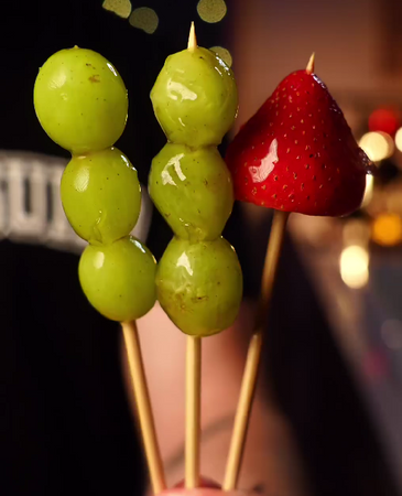 Fruit tanghulu — candied fruit skewers prepared with a Cooking Guild knife