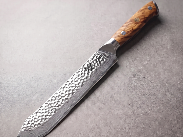 Silver Dynasty 9.5-inch Damascus butcher knife with hand-hammered blade, an example of a full-size butcher knife