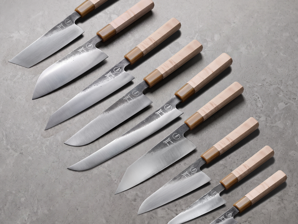 The complete Torii Series — nine hand-forged knives with maple wa-handles