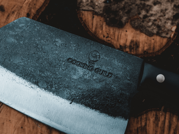Hand-forged chef knife blade showing the best HRC hardness rating for a kitchen knife