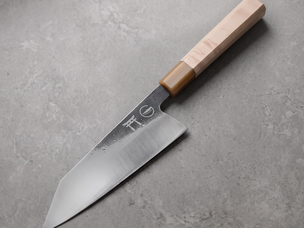 Bunka vs gyuto comparison: a Torii 8-inch bunka with its flat edge and reverse-tanto tip