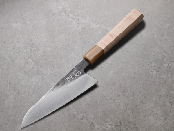 Hand-forged Torii chef knife with a thin keen edge, the geometry a low-carbide steel like Ginsan suits