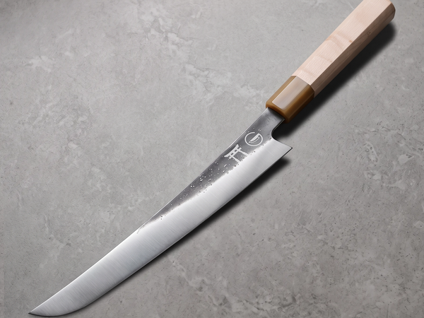 Slicing a rested brisket across the grain with a long hand-forged sakimaru slicer