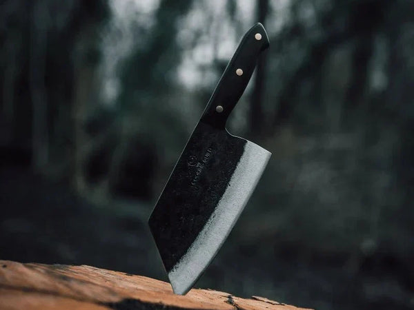 Chinese cleaver with rectangular blade on a wooden cutting board