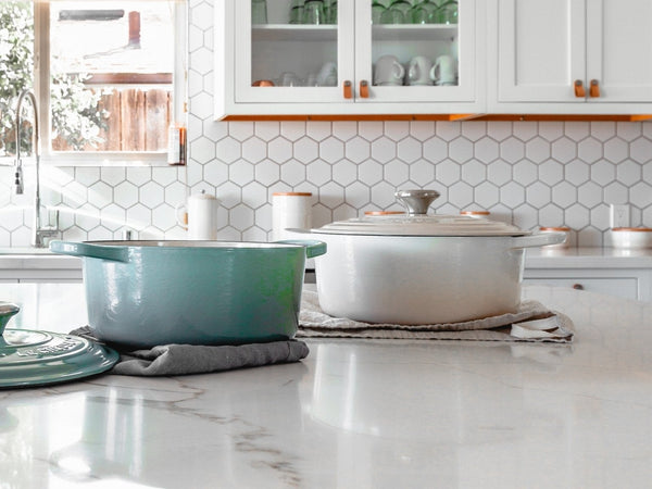 Bright, newly unpacked home kitchen with a wooden cutting board and knives on the counter