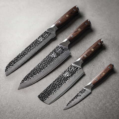 Damascus Dynasty Emperor Set: 8 inch bread, 8 inch chef, 7 inch nakiri and 4 inch paring knives laid on slate